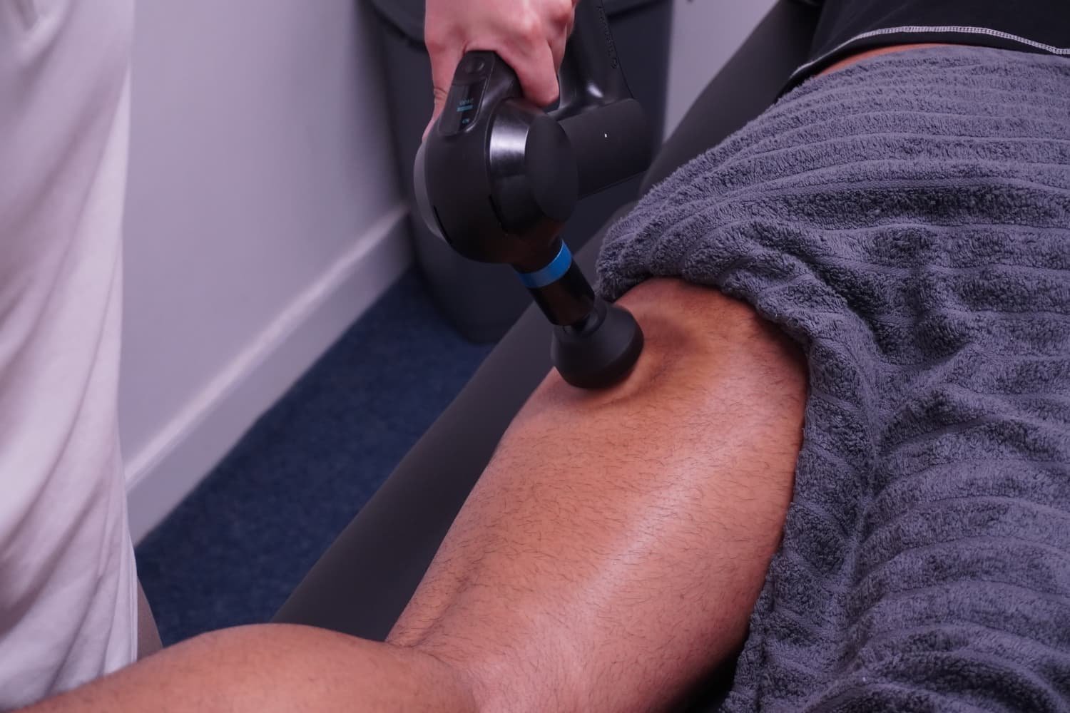 Deep tissue sports massage with massage gun at Muscle Relief Therapy Swansea